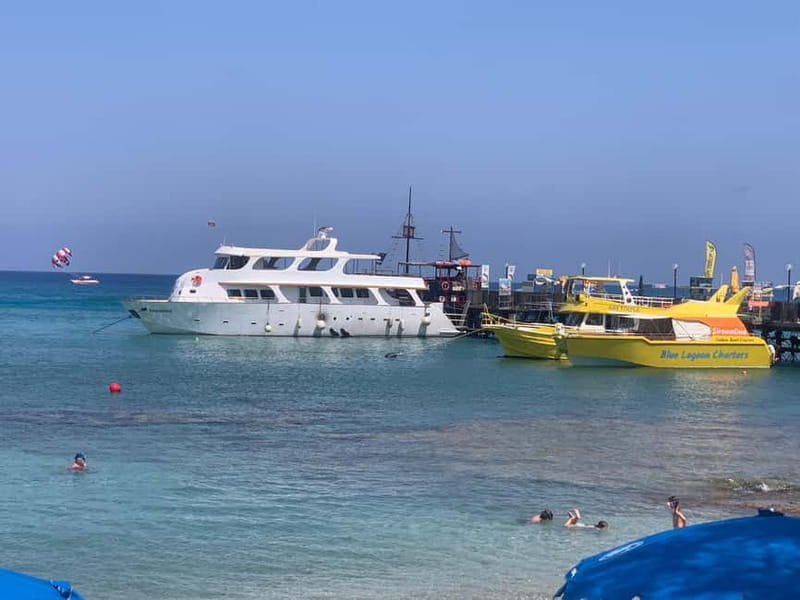 Protaras: 80s and 90s Sunset Cruise with Cypriot Dinner & DJ - Swimming in the Blue Lagoon and Turtle Bay